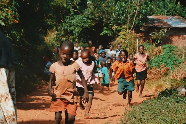 Children playing outdoors in an African setting